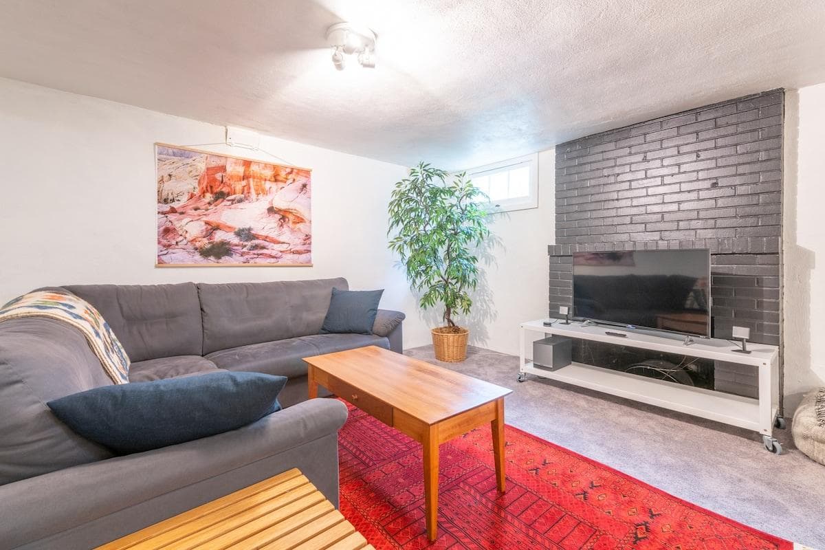 Furnished basement living room with plenty of room to relax