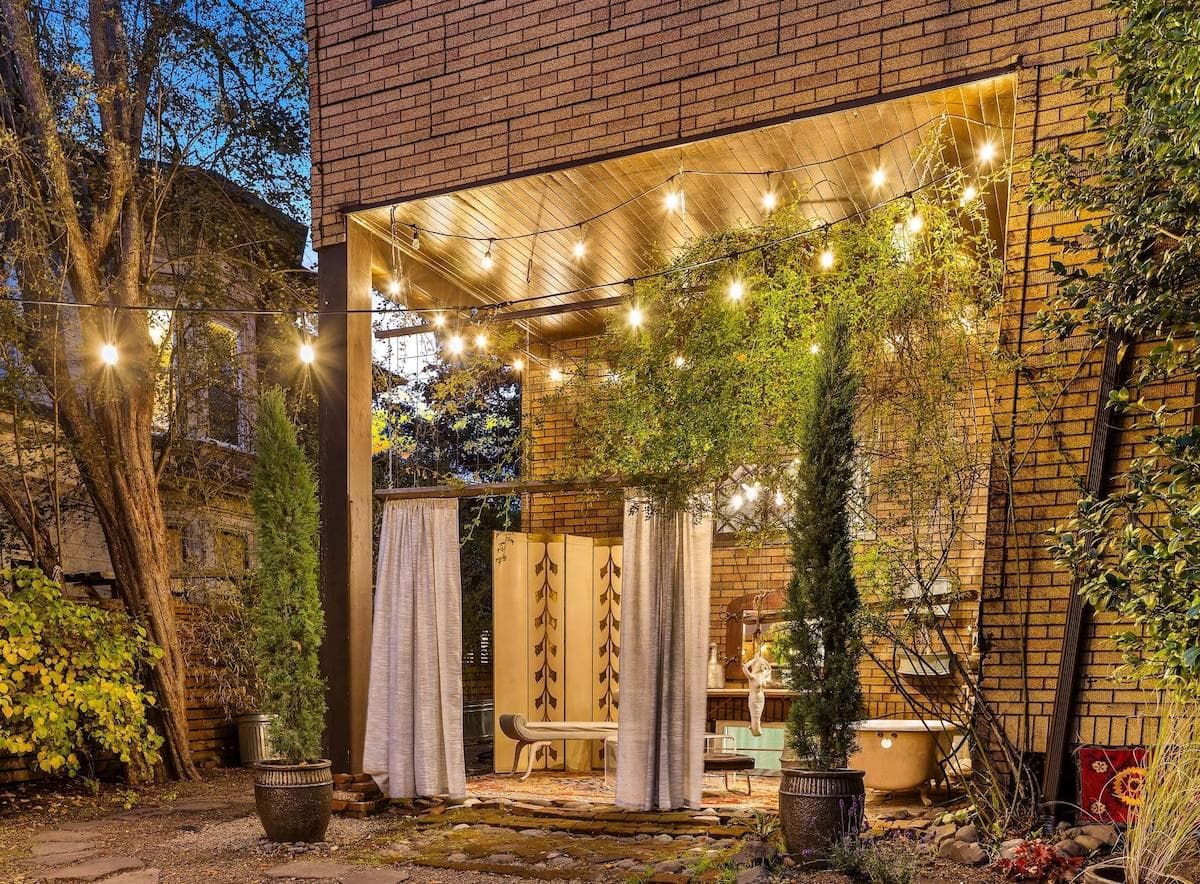 Escape to your own private backyard oasis, featuring an outdoor bathtub for ultimate relaxation.